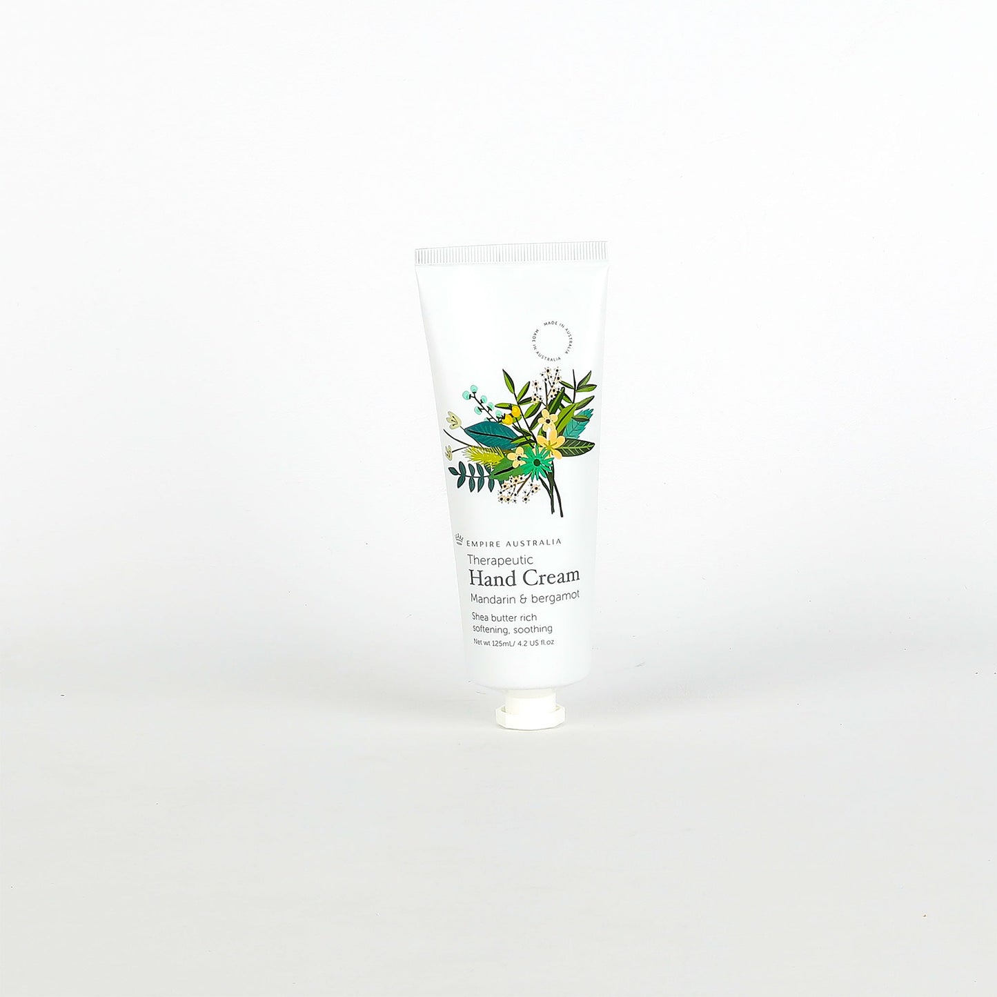 Hand cream with a floral label on a white background