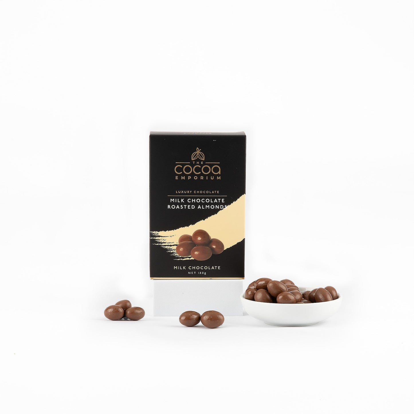 Cocoa Emporium milk chocolate roasted almonds with packaging on a white background