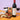 Penfolds Koonunga Hill Shiraz wine bottle with snacks and popcorn on a colorful background