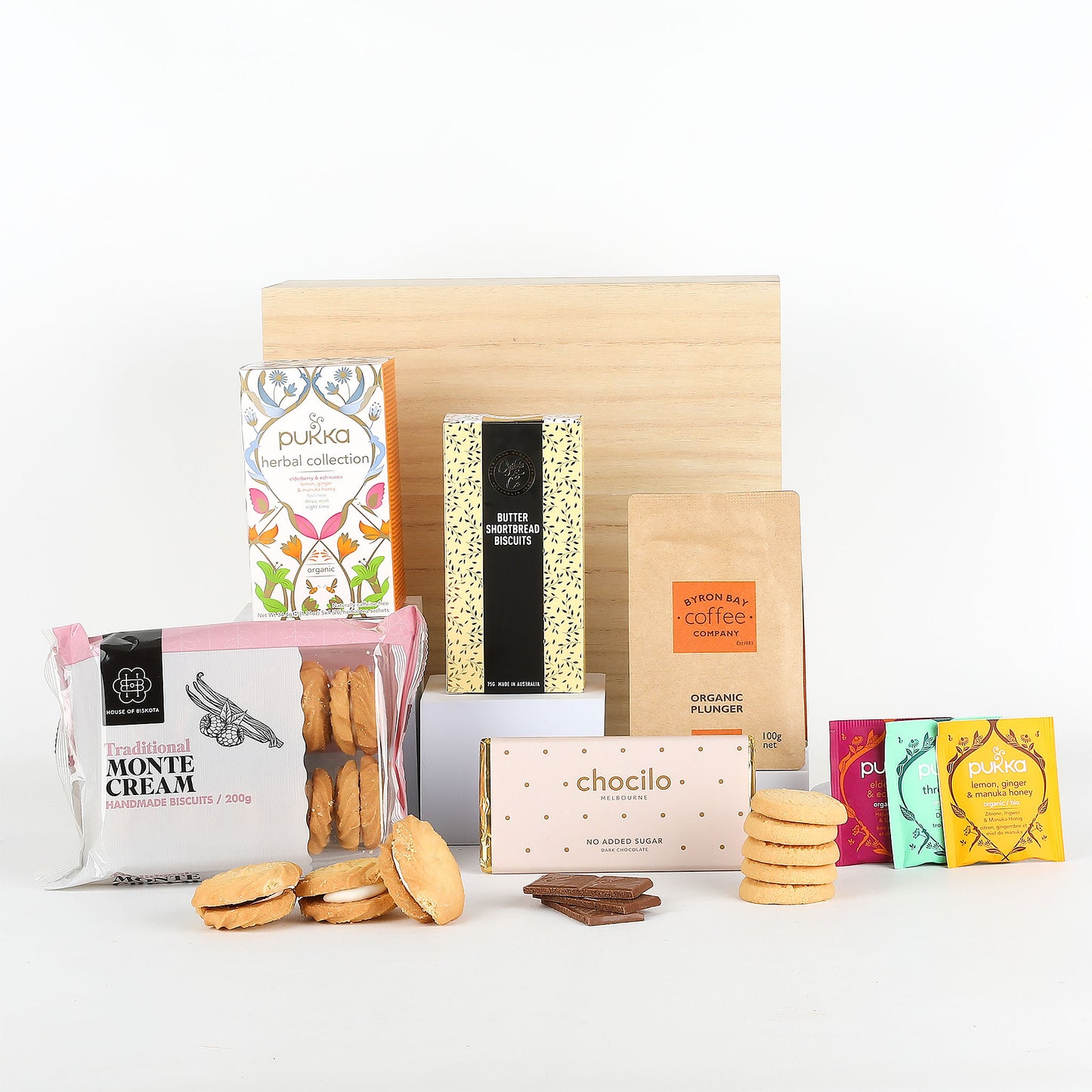 Assorted food products including cookies, tea, and biscuits on a white background