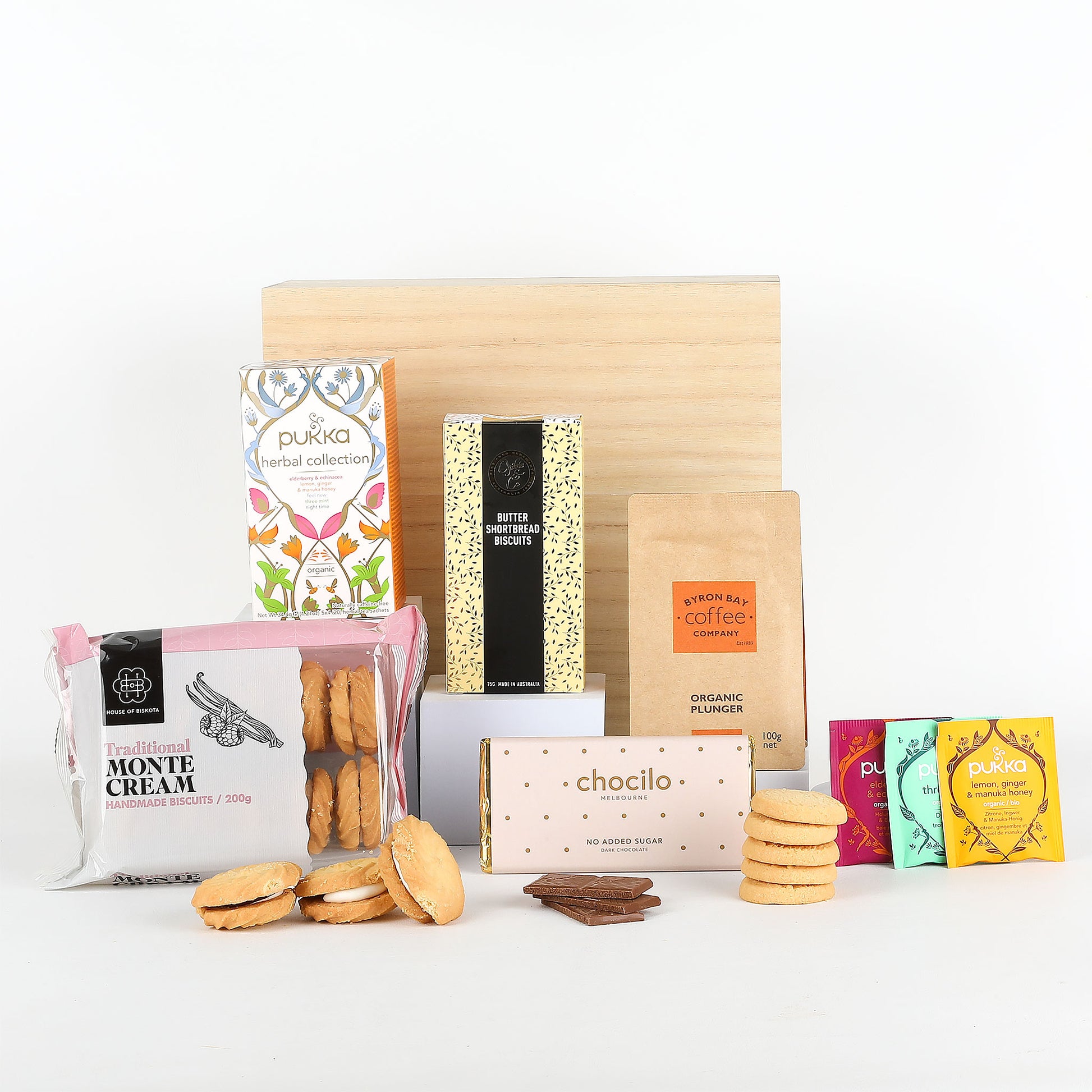 Assorted food products including cookies, tea, and biscuits on a white background