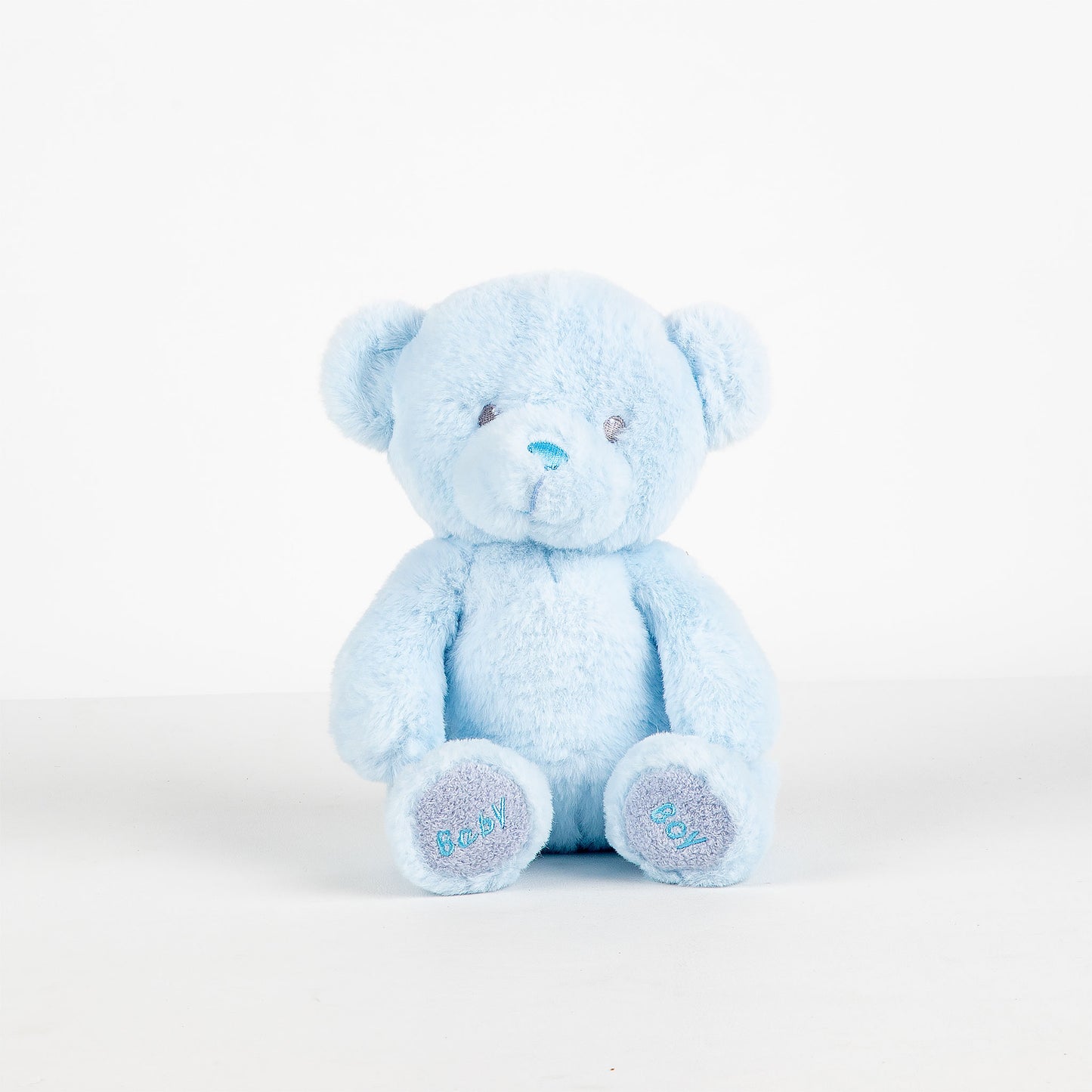 Blue teddy bear on a white background