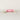 Pink chocolate cracker with gold accents on a light gray background