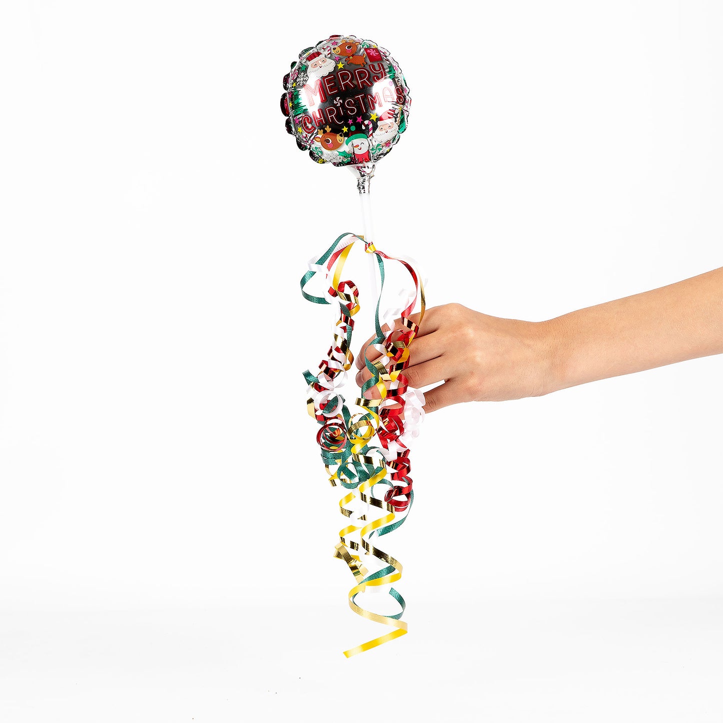 A hand holding a "Merry Christmas" balloon against a white background