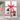 Gift set with Henkell Piccolo Sparkling Wine, Christmas pudding, and other items on a neutral background.