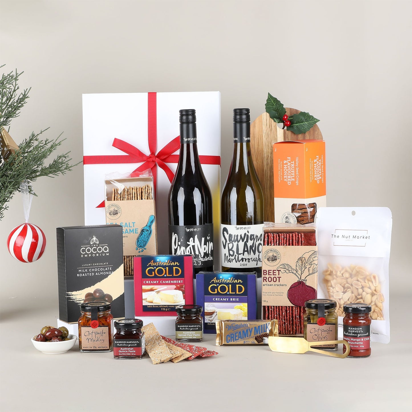 Assorted gourmet food and wine gift set on a neutral background