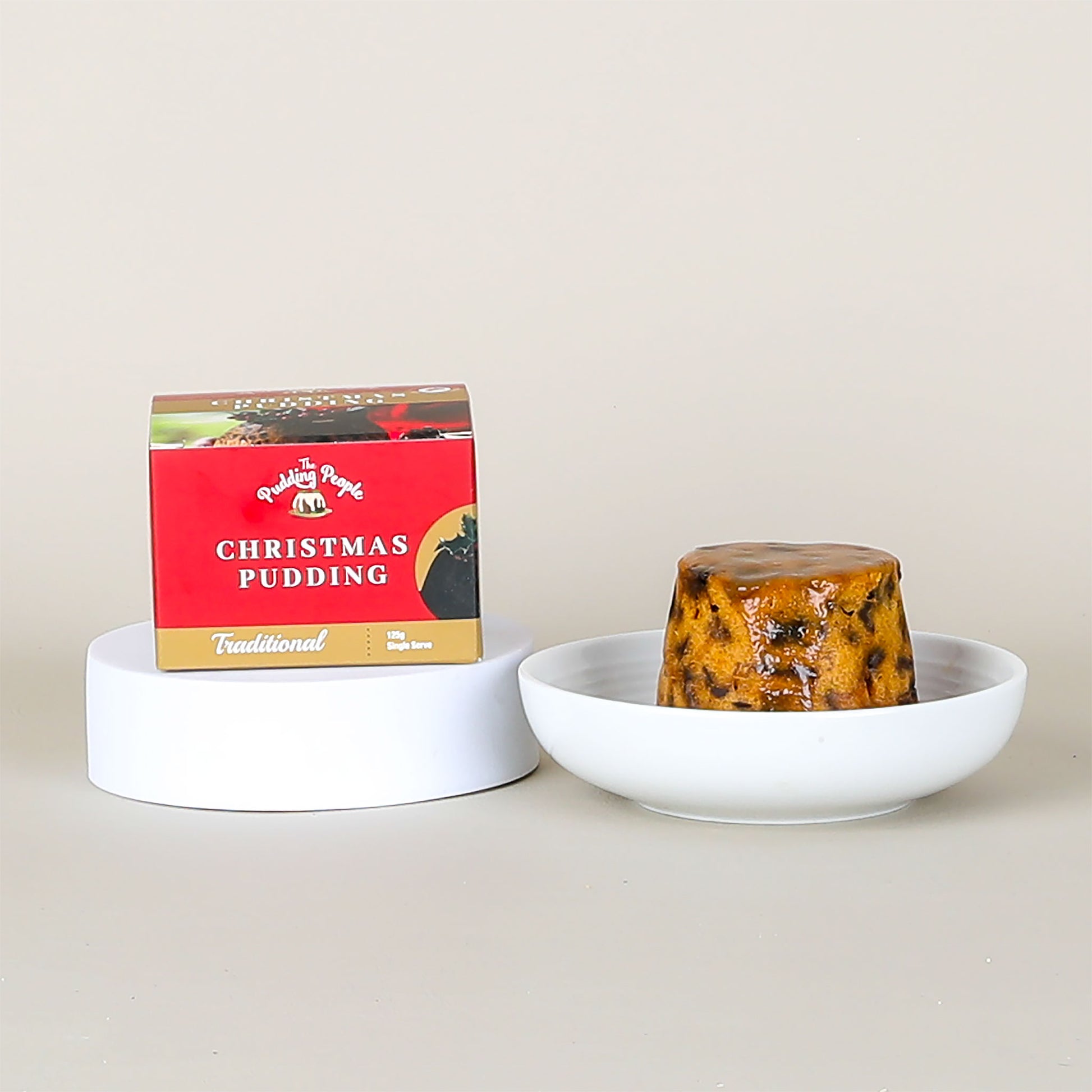 Christmas pudding with a red box on a white background
