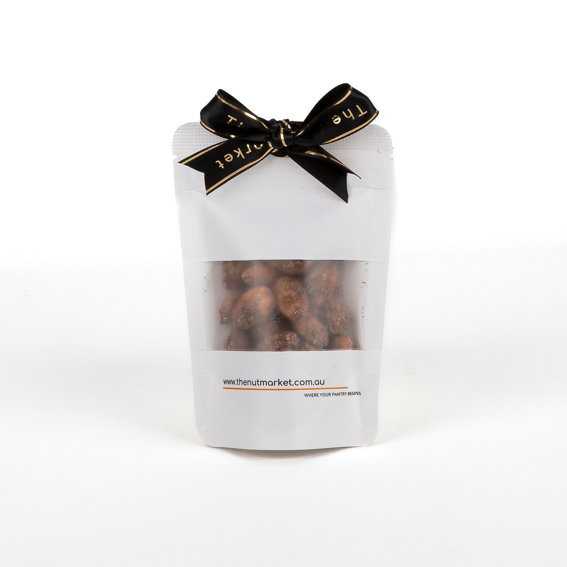 White packaging of roasted peanuts with a black bow on a white background.