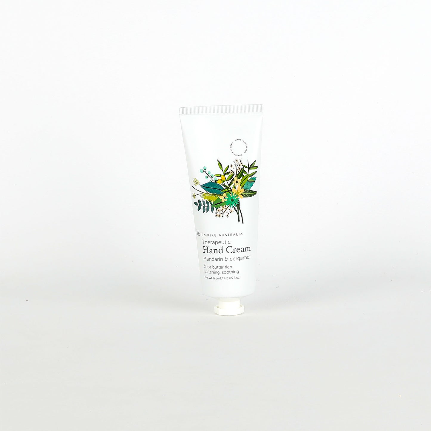Hand cream with floral design on the label against a white background