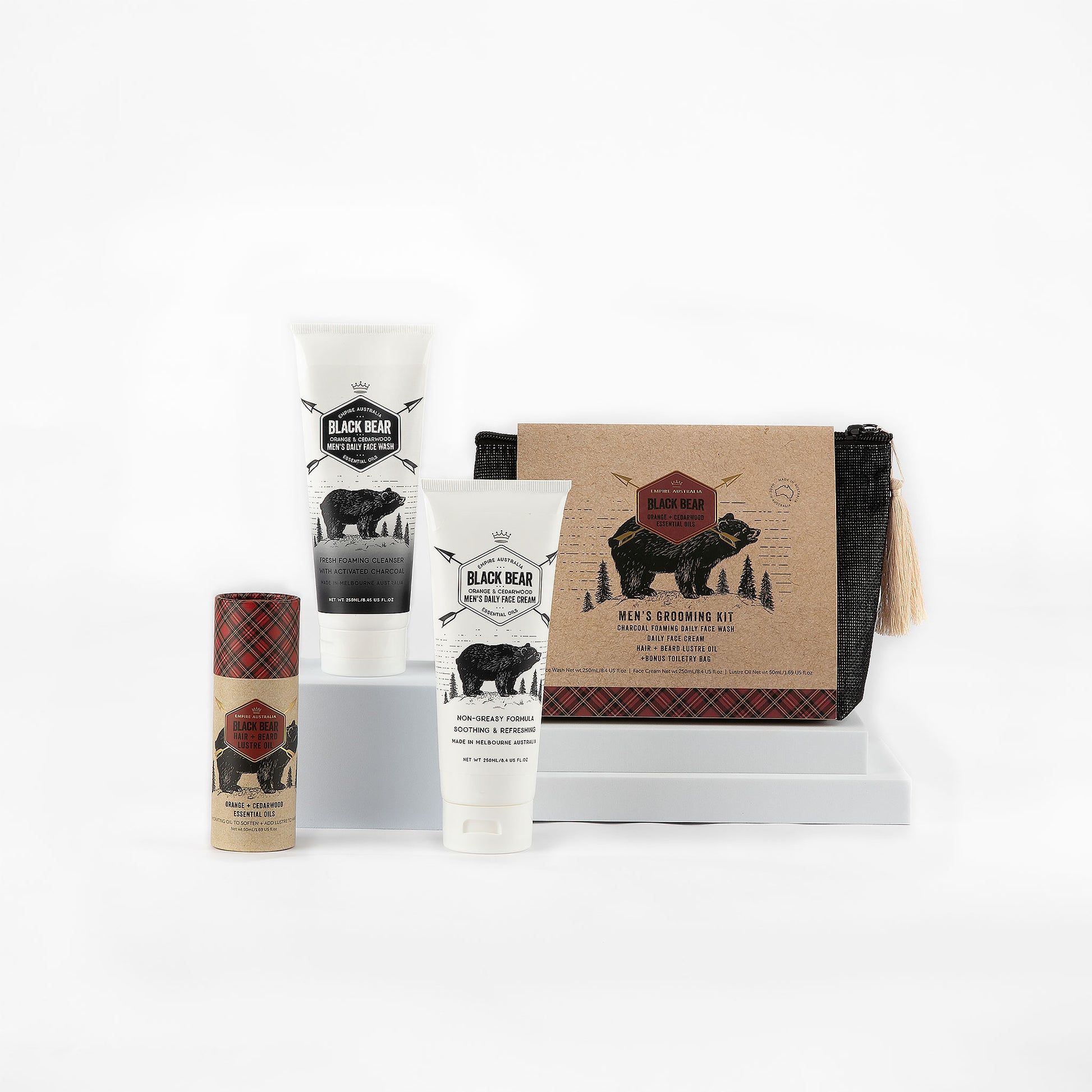 Black Bear men’s grooming kit with a selection of quality skincare essentials that include a daily face wash, face cream and body balm on a white background