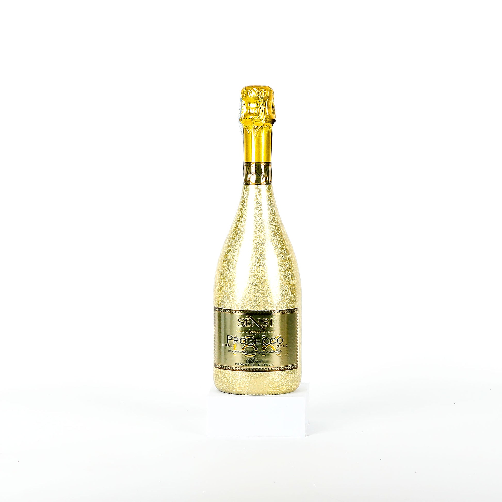 Gold sparkling wine bottle on a white background