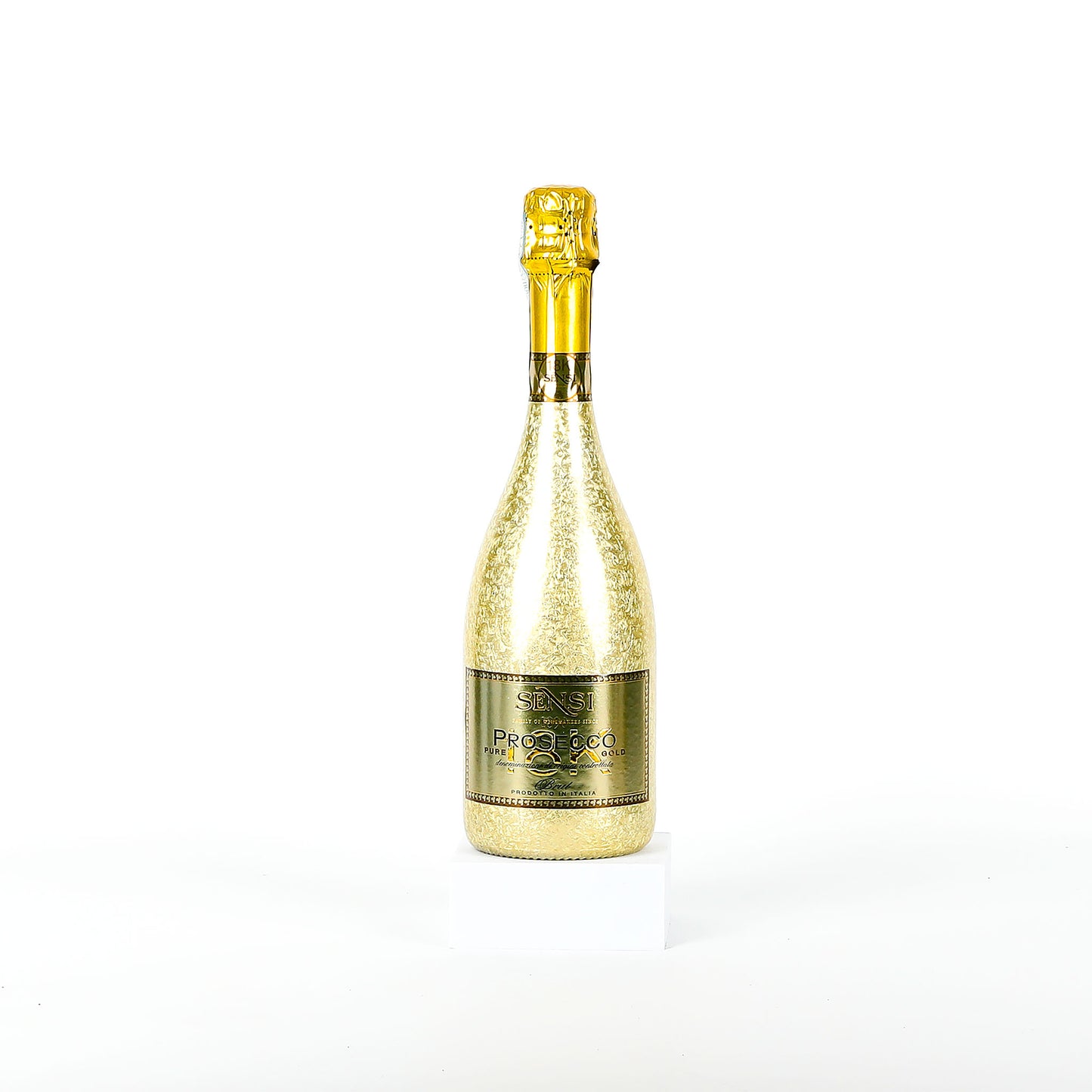 Gold sparkling wine bottle on a white background