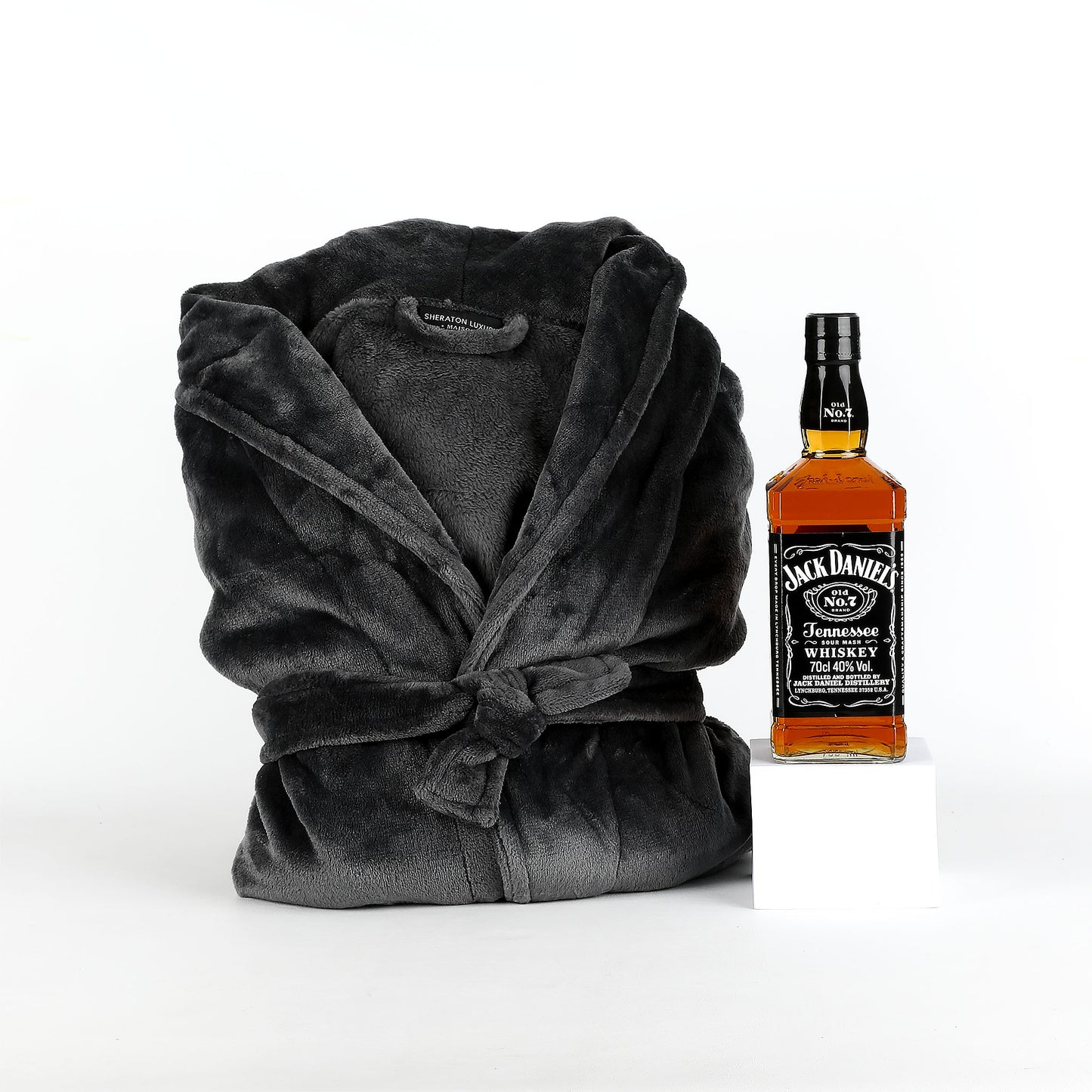 Gray robe and Jack Daniel's whiskey bottle on a white background