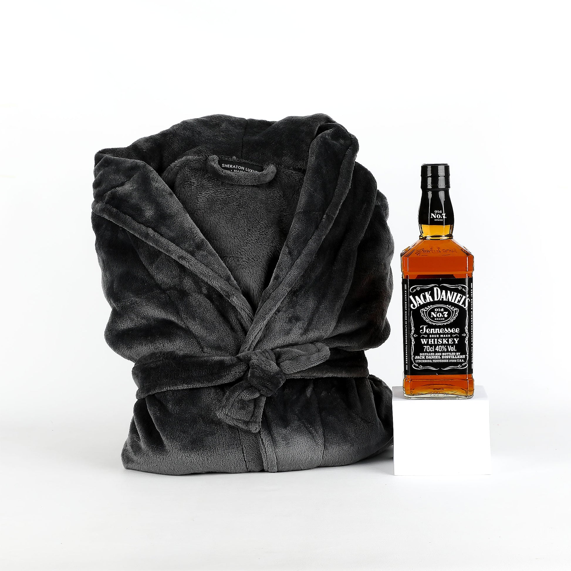 Gray robe and Jack Daniel's whiskey bottle on a white background