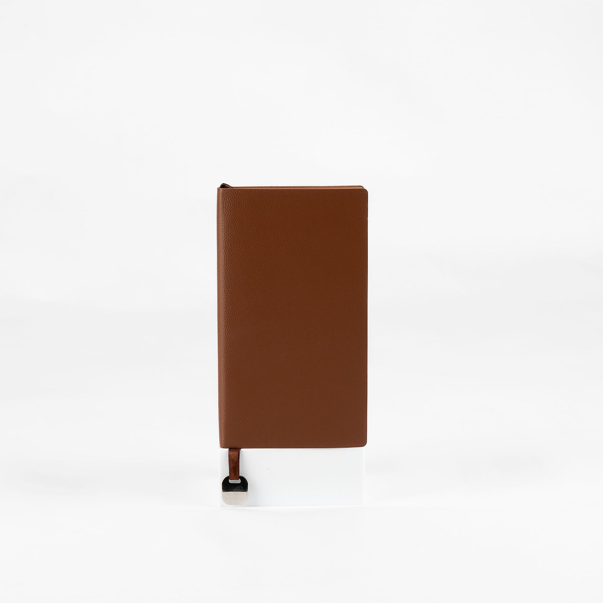 Brown leather-look notebook on a white background
