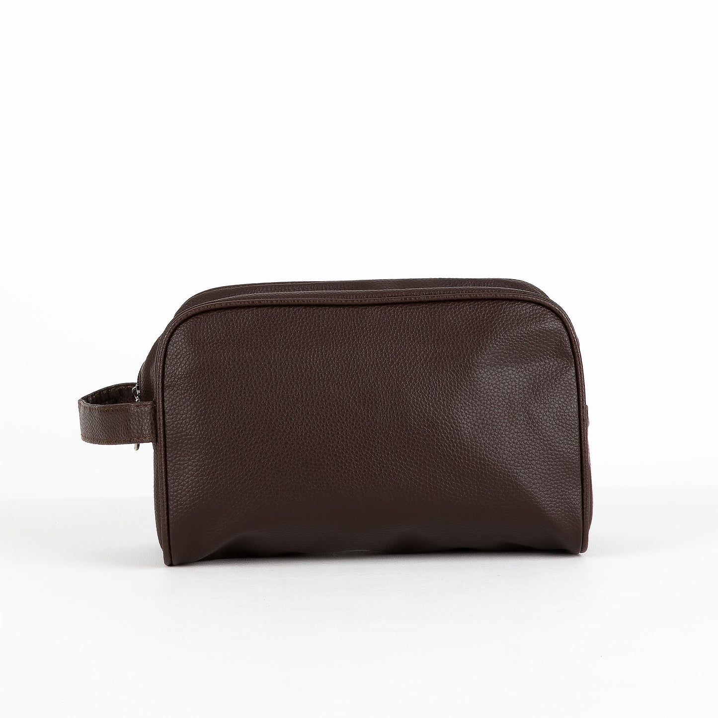 Leather-look toiletry bag on a white background