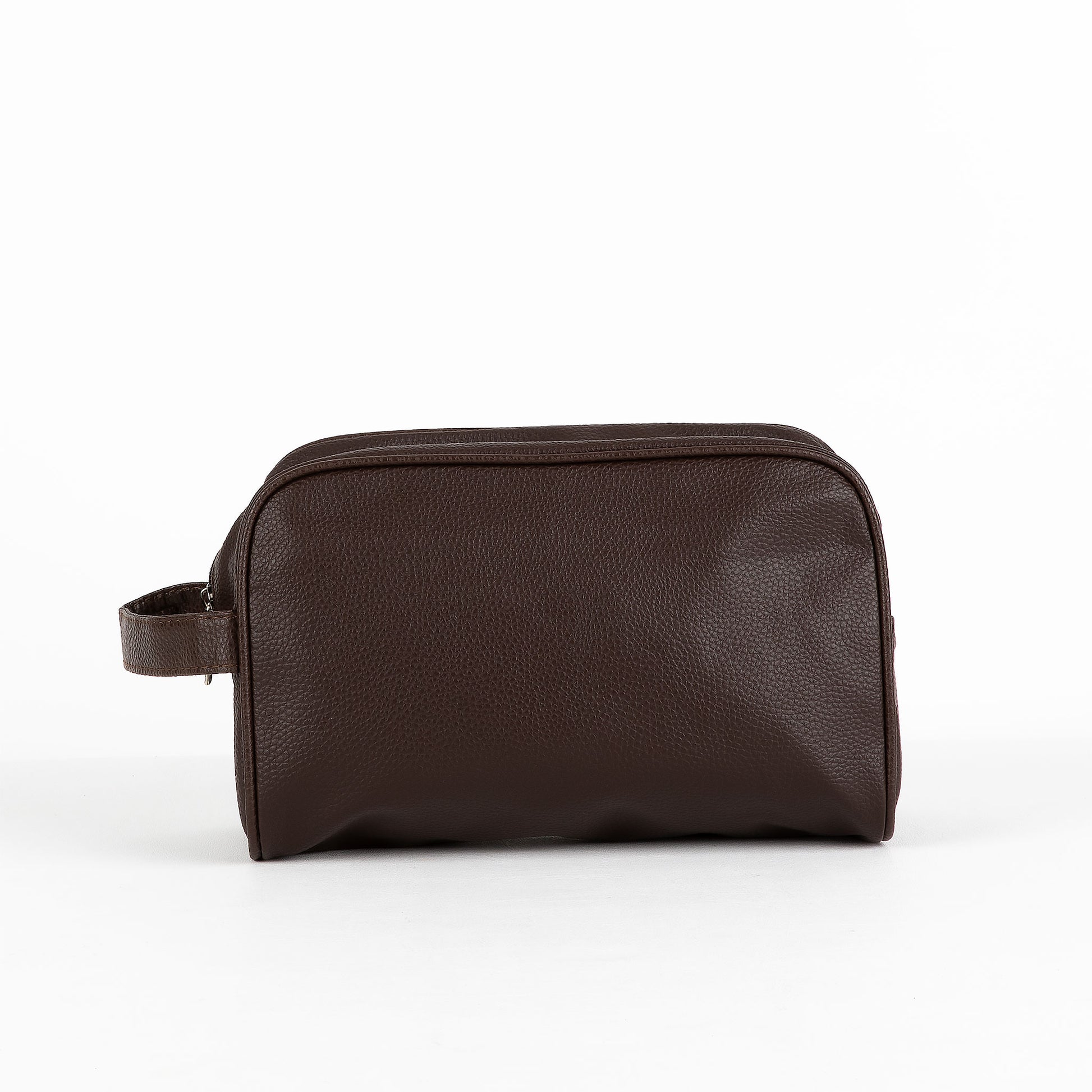 Leather-look toiletry bag on a white background