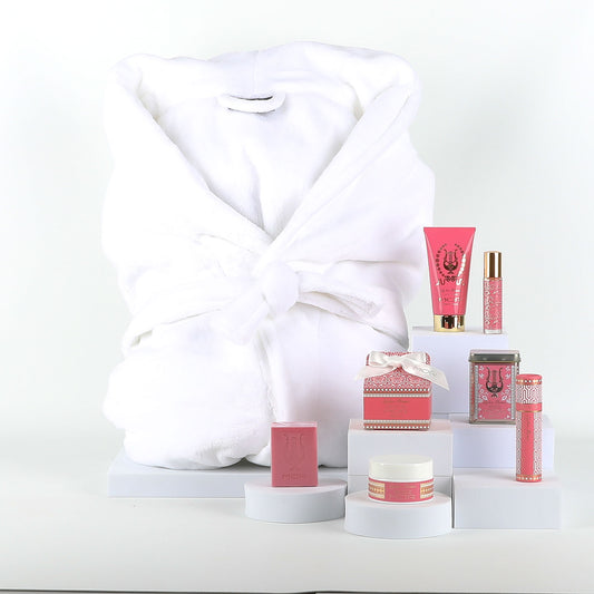 Cosmetic products with a white robe on a white background