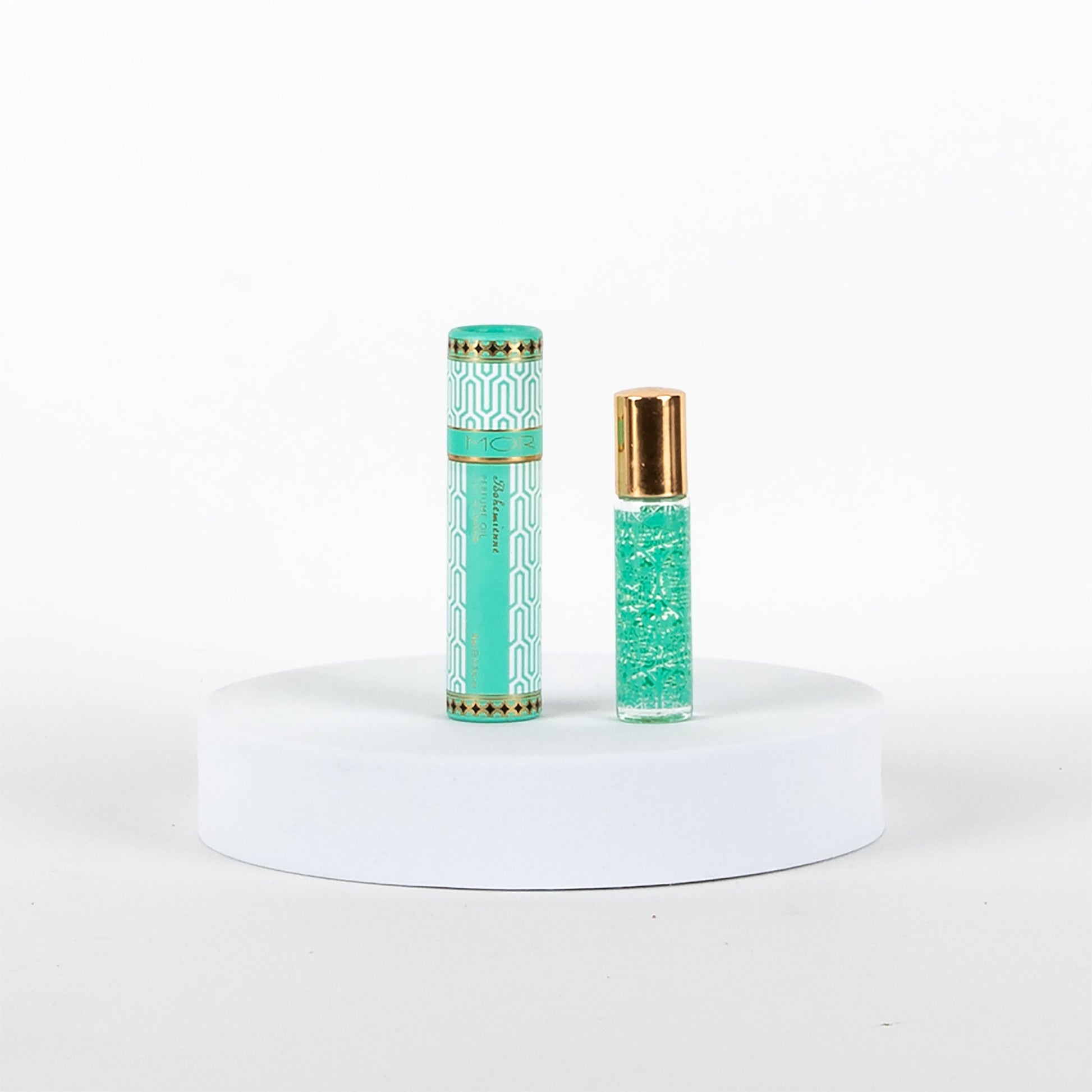 MOR perfume oil on a white platform