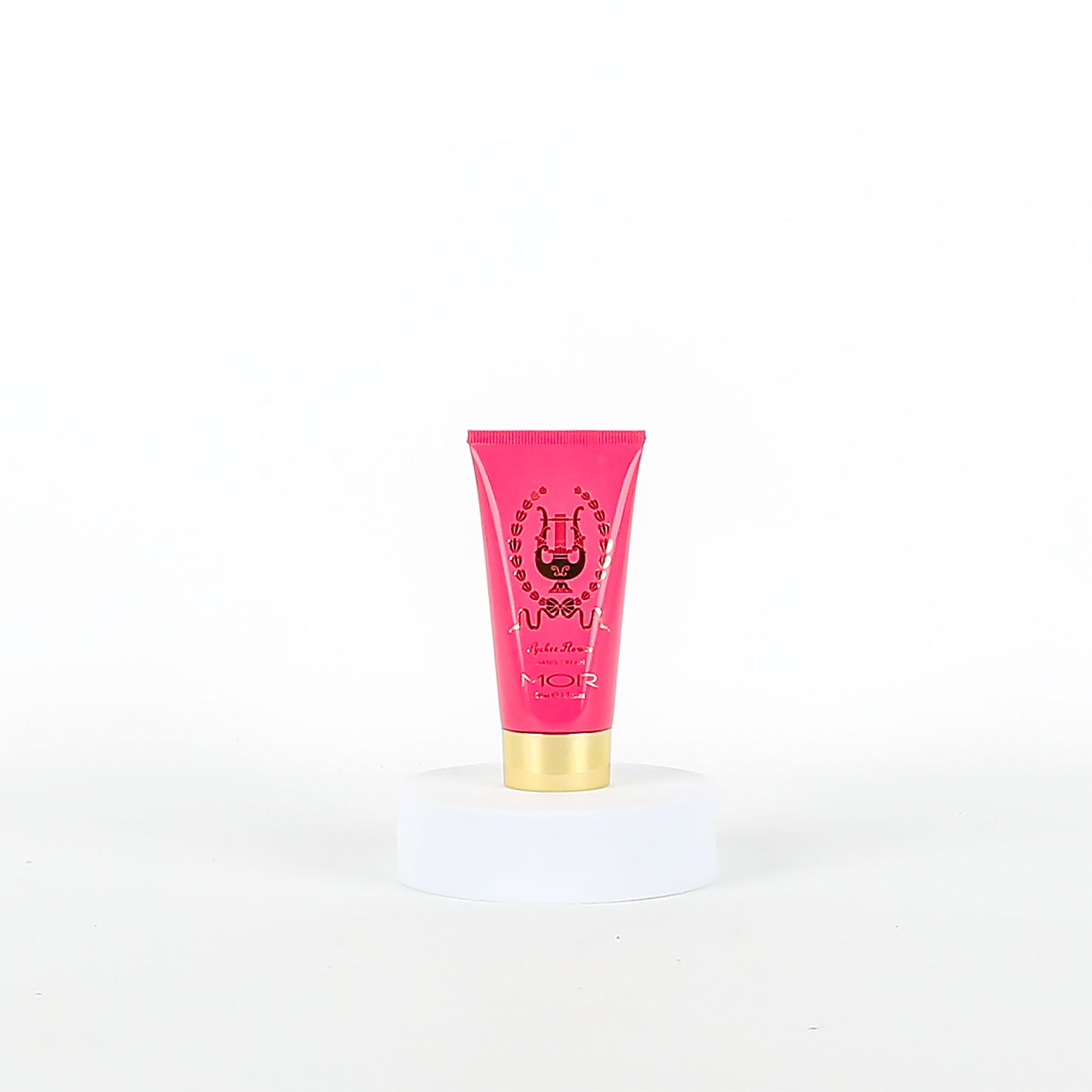 Pink MOR tube with gold cap on a white background