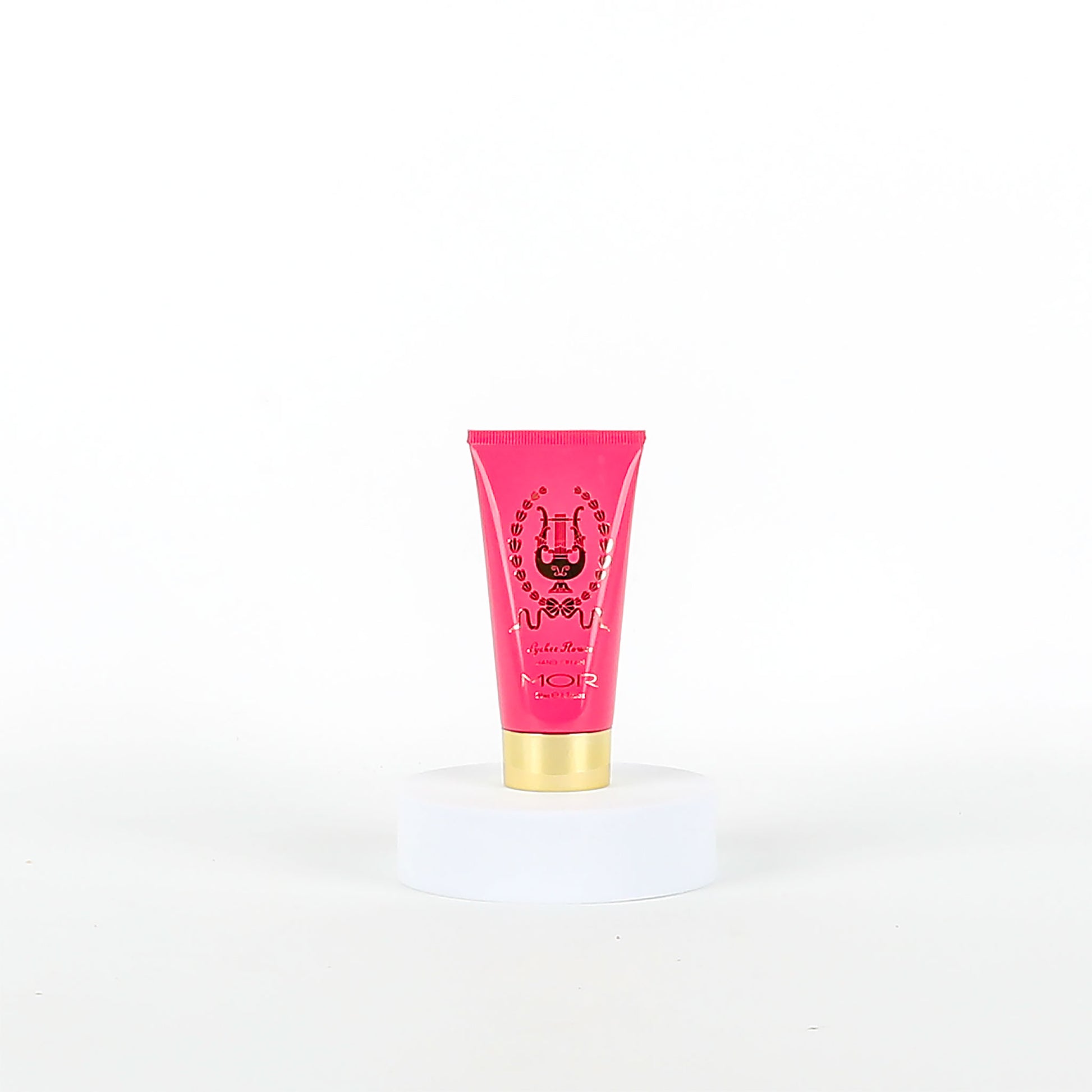 Pink MOR tube with gold cap on a white background