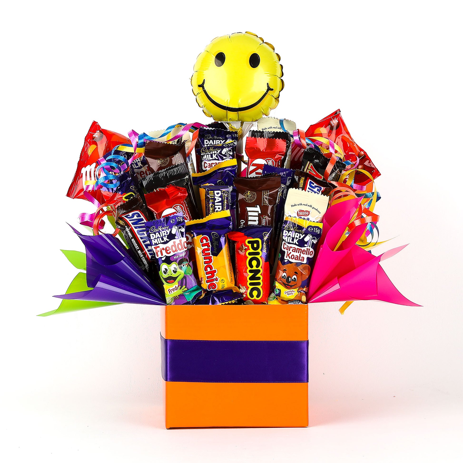 Chocolate bouquet with a smiley face balloon on a white background
