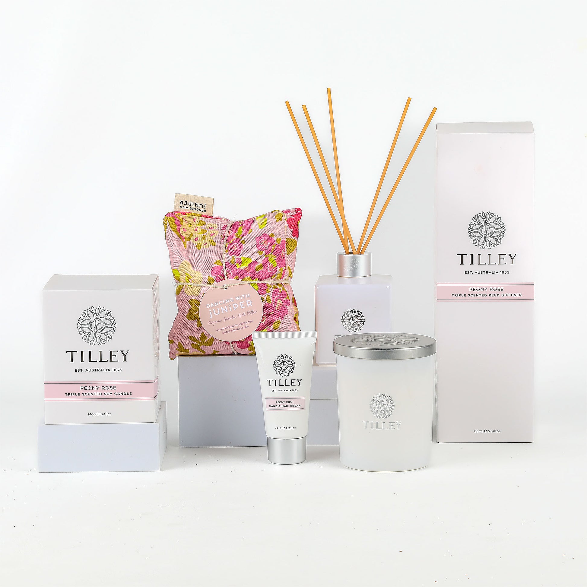 Tilley brand products including candle, diffuser, and cream on a white background