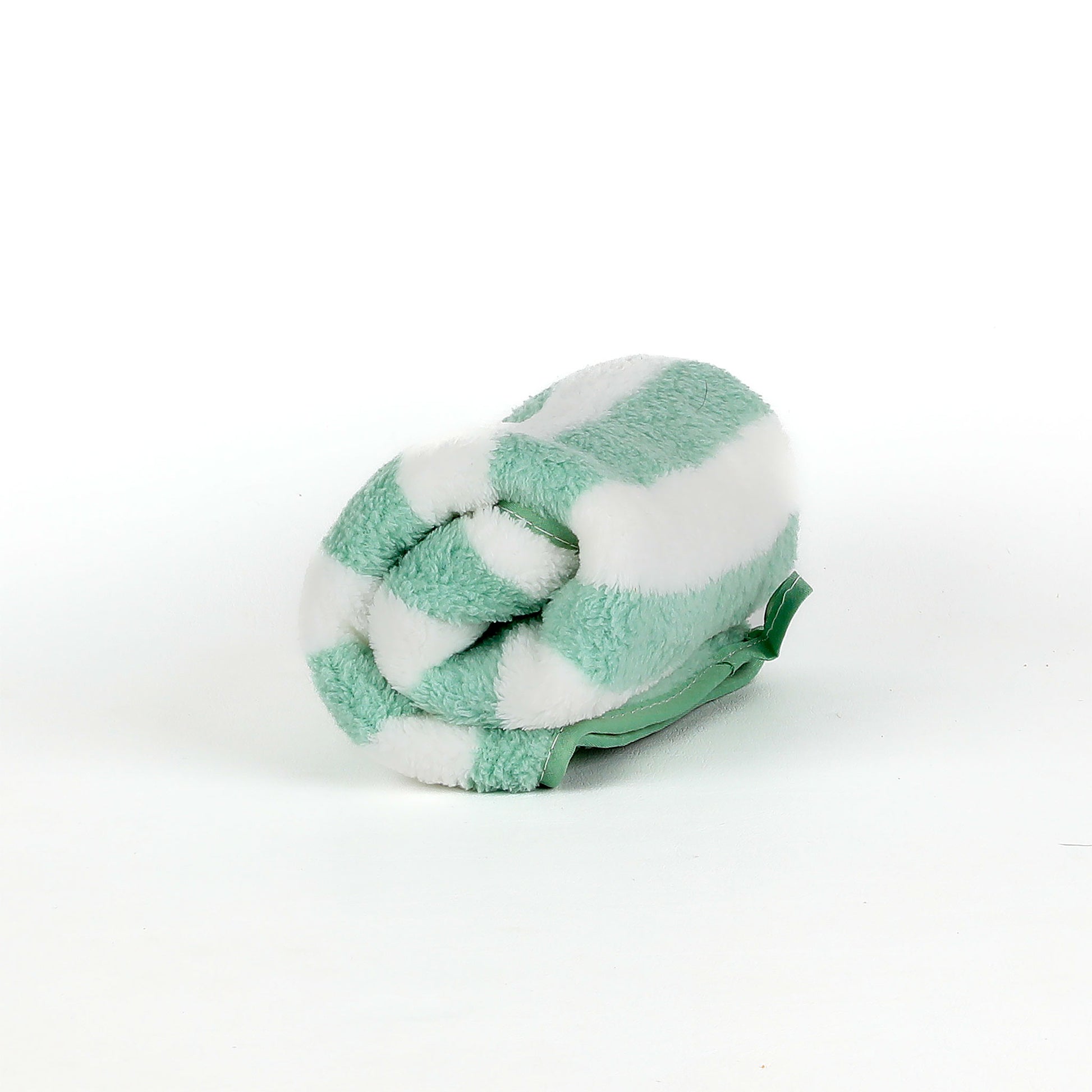 Green and white striped towel on a white background