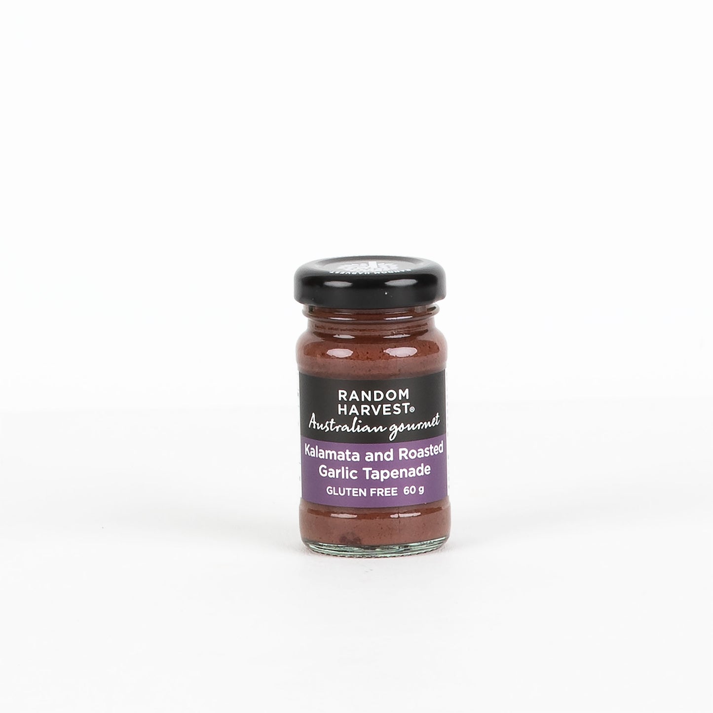 Jar of Random Harvest tapenade on a white background