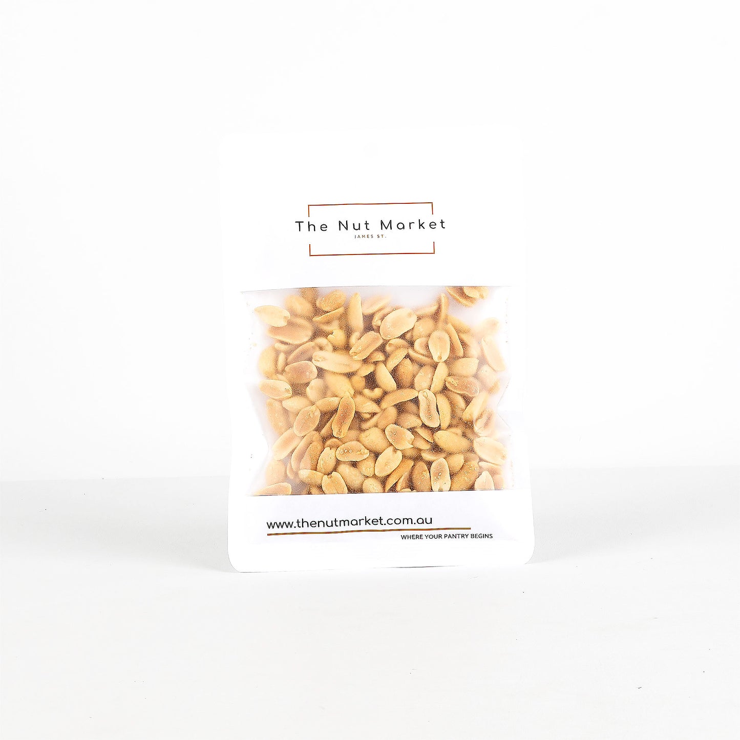 Pack of roasted peanuts from The Nut Market on a white background