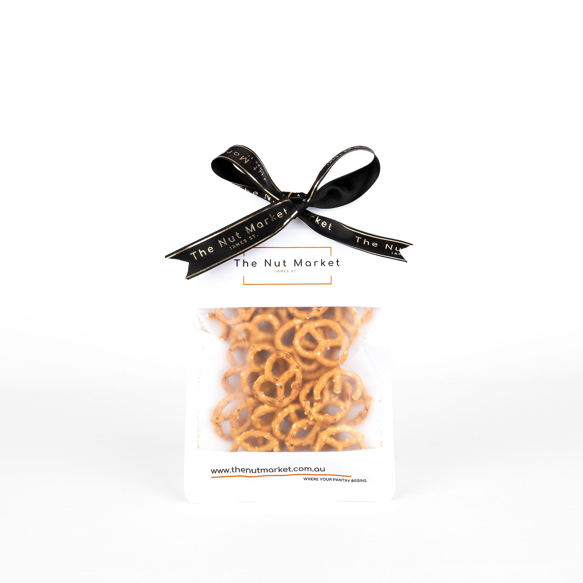 Packaged pretzels with a black ribbon and 'The Nut Market' branding on a white background