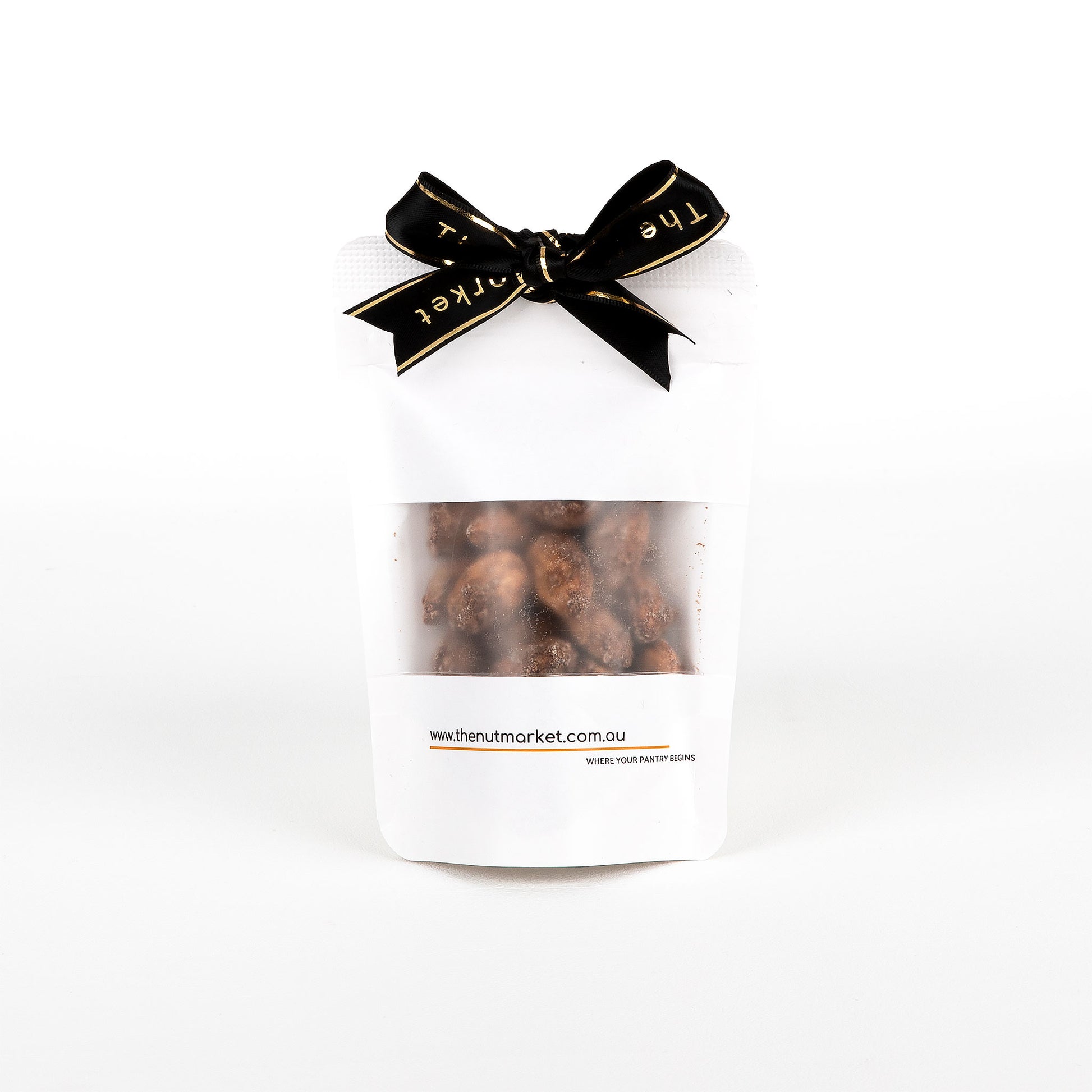Pack of nuts with a black bow on a white background
