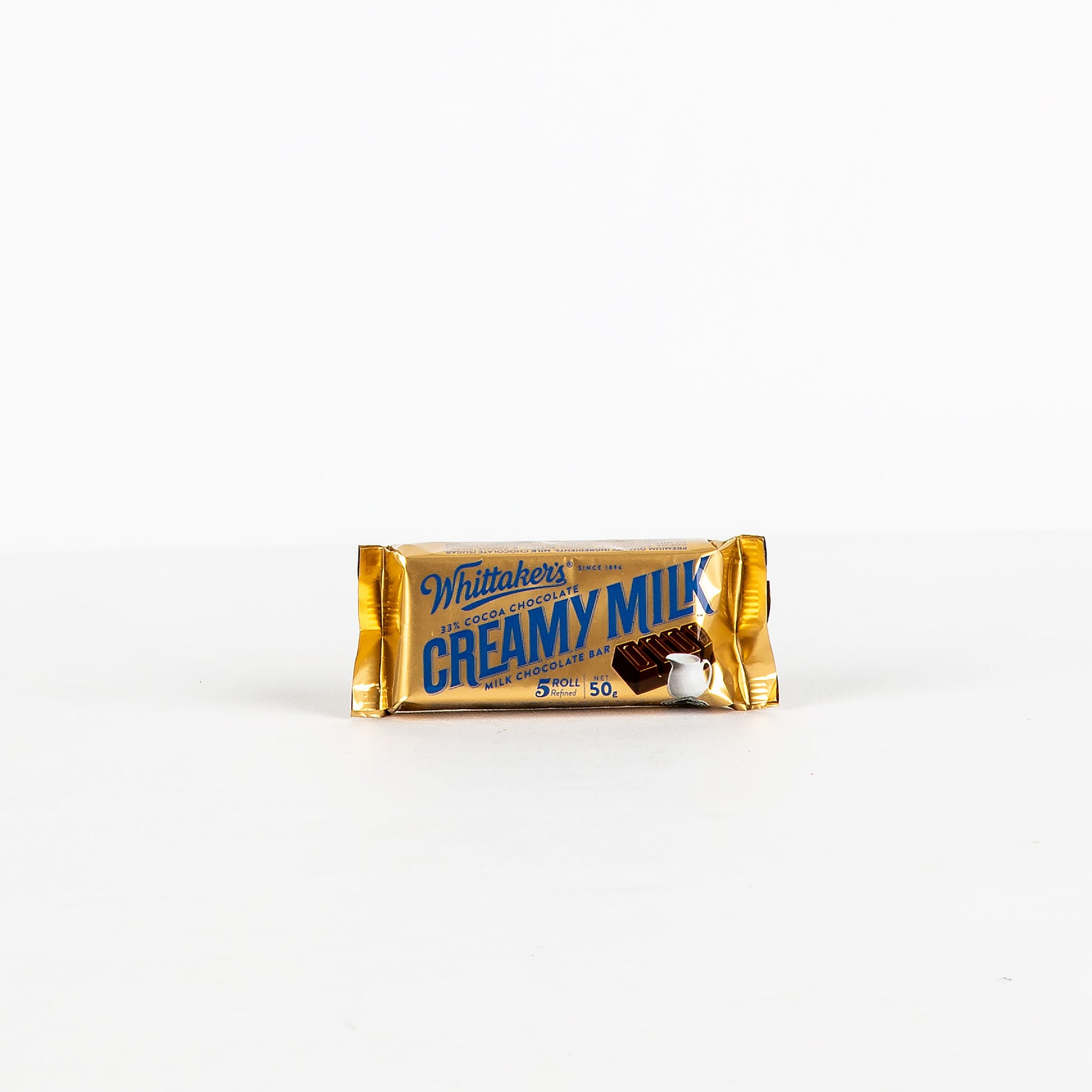 Whittaker's Creamy Milk chocolate bar on a white background